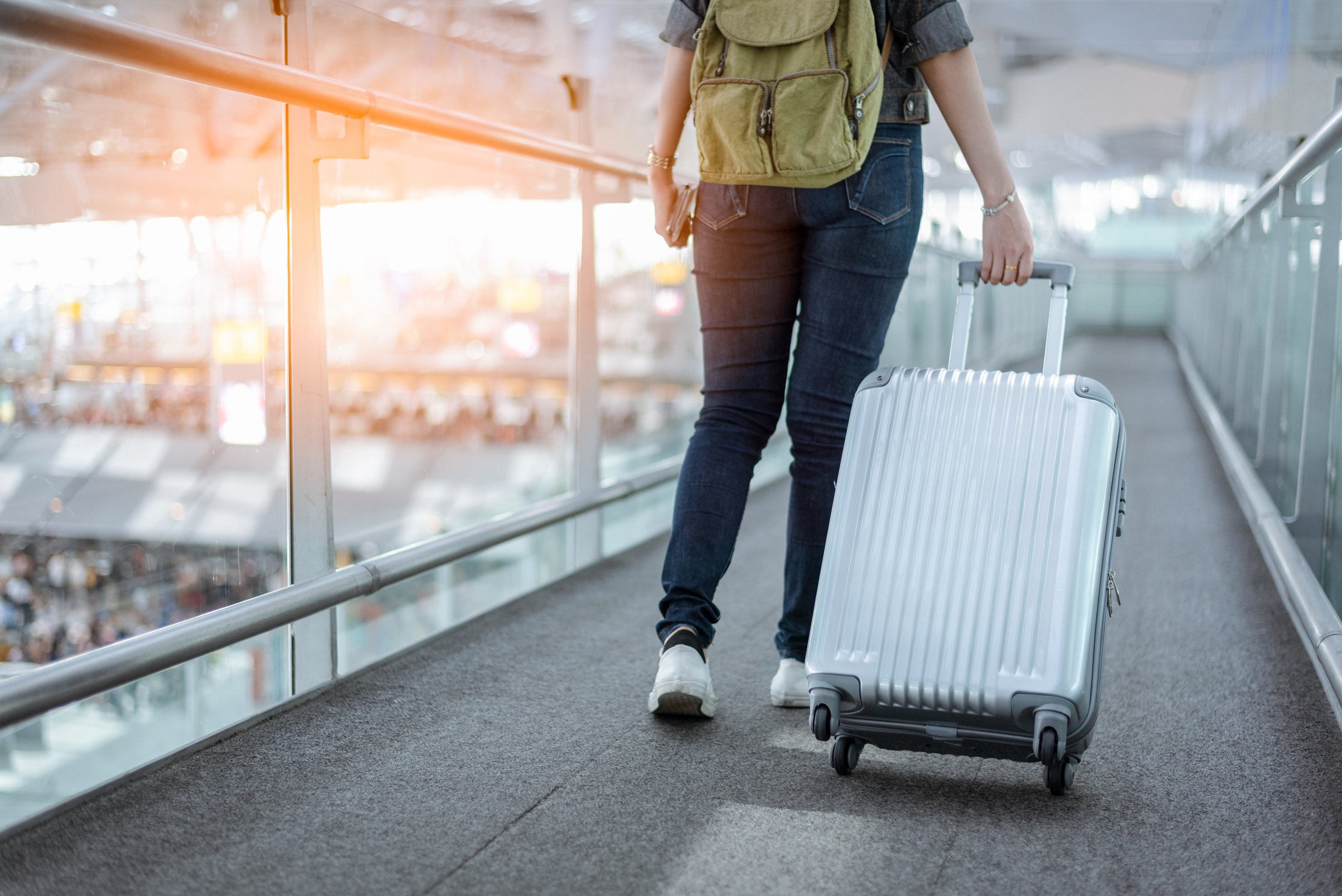 Woman with Trolley in the Airport